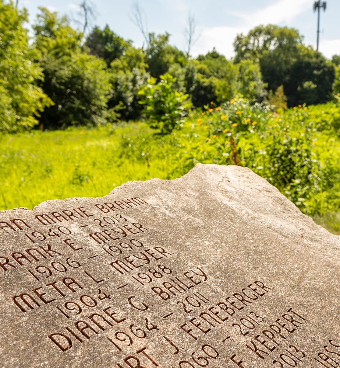 Photo of a granite boulder memorial inside Prairie Rest at Forest Home Cemetery